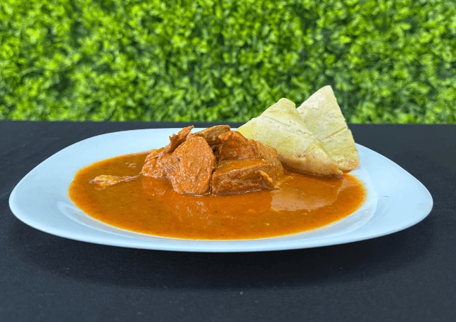 Pork in Guajillo Chili Sauce with Corundas